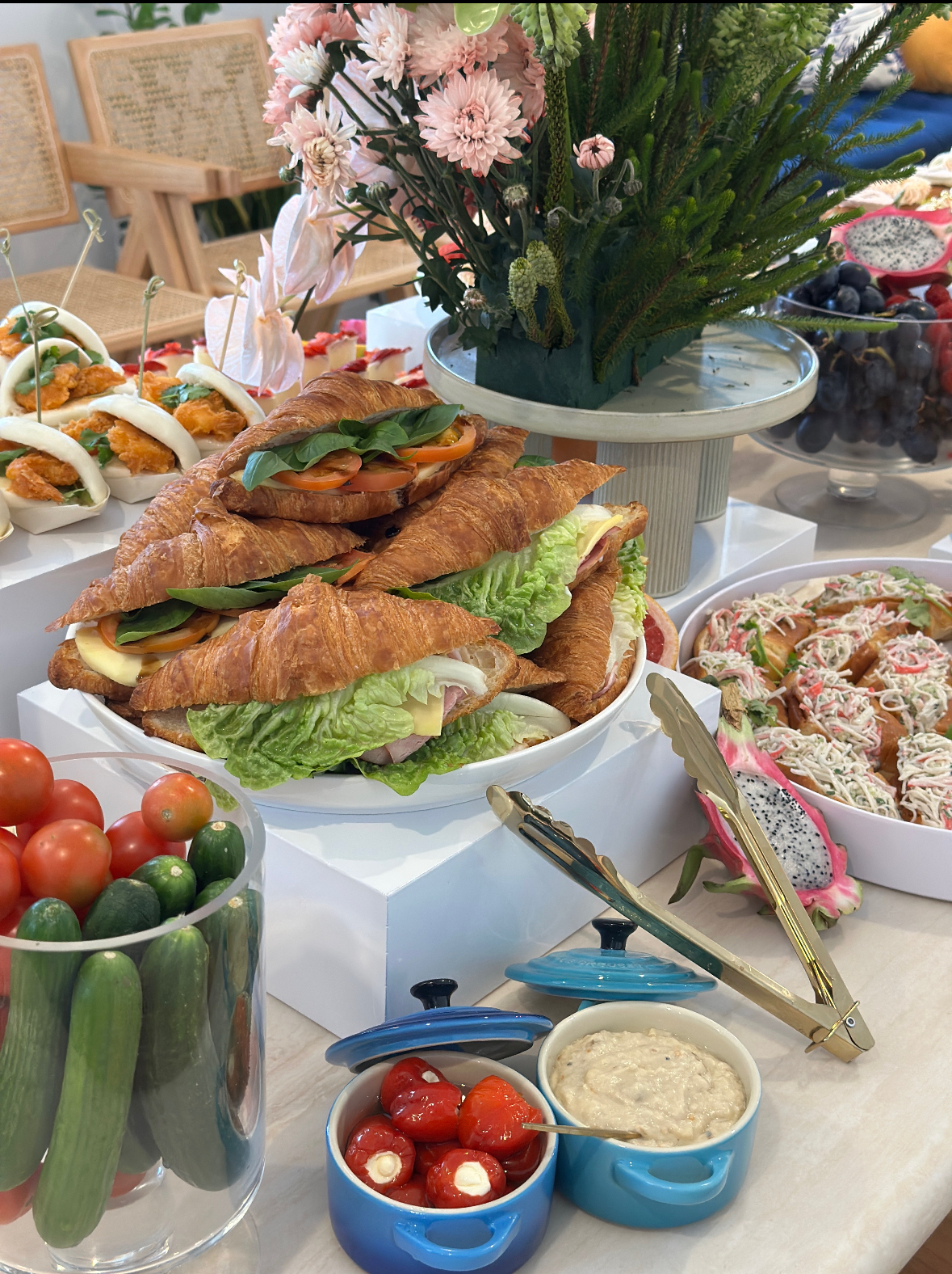 White buffet risers set up to display food