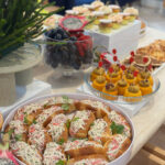 White buffet risers set up to display food