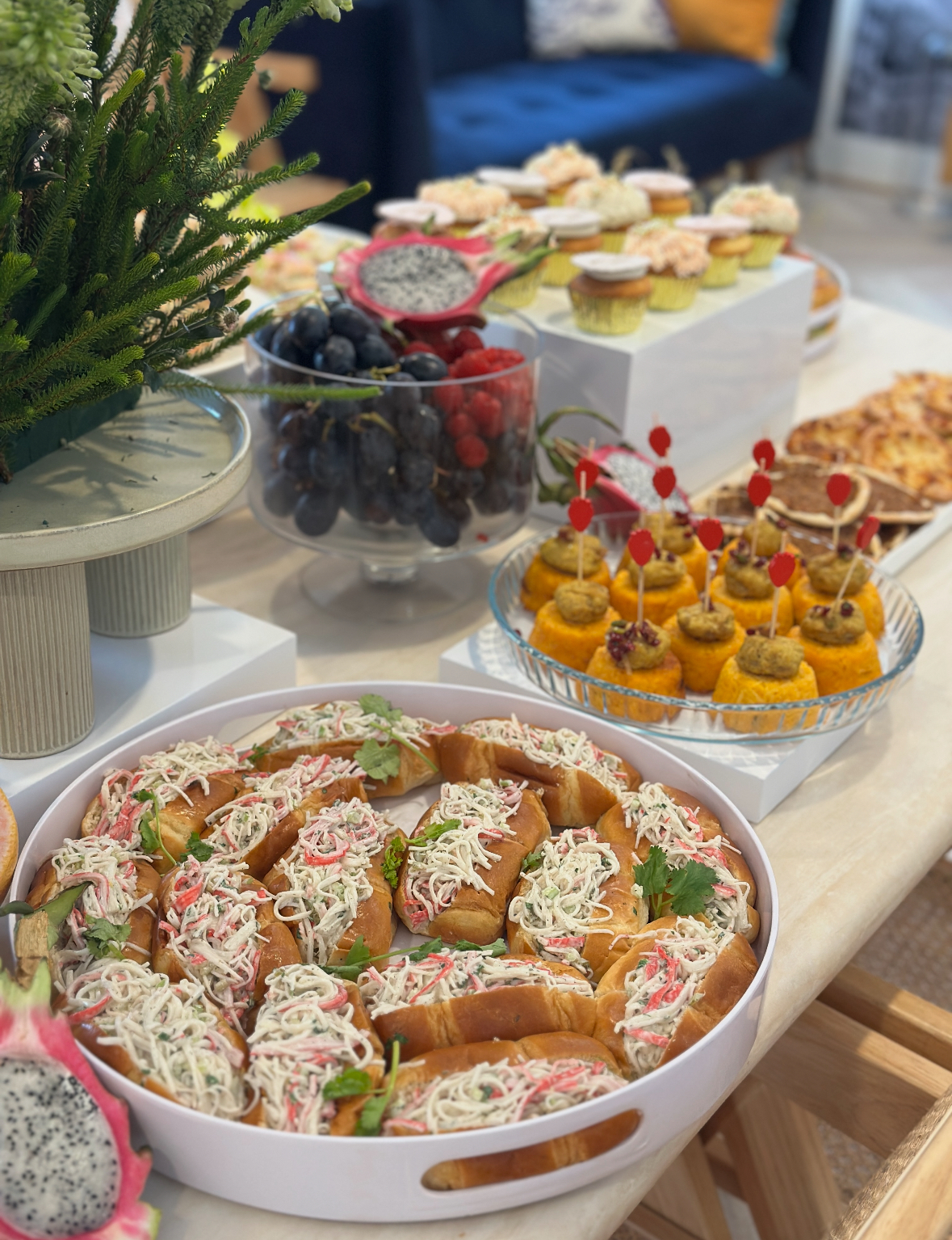 White buffet risers set up to display food